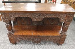 An eighteenth century carved and inlaid oak serving table, wifth 118cm.