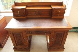 A late Victorian carved mahogany pedestal desk, with 137cm.