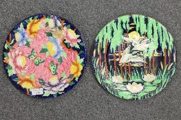 Two Maling plaques - decorated with butterflies and ducks in flight, diameter 28.5 cm.  CONDITION