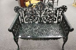 A Victorian style cast iron garden bench,