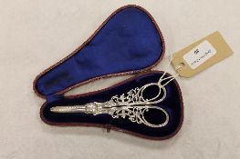 A pair of silver scissors, Sheffield 1910, cased. CONDITION REPORT: Excellent condition, some