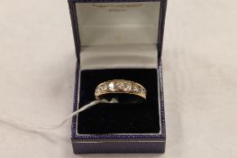 A 14ct gold nine stone diamond ring. CONDITION REPORT: Good condition.