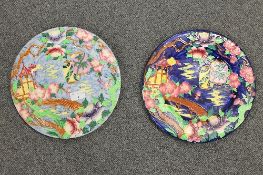 Two Maling plaques - decorated with oriental lanterns, diameter 28.5 cm. CONDITION REPORT: Time aged