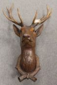 An early twentieth century Black Forest carved deer's head. CONDITION REPORT: Good original