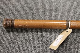 A late nineteenth century walking cane, with removable terminal revealing a glass measure.