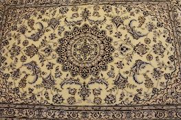 An Iranian wool carpet, on cream ground, 173 cm x 76 cm.