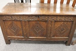 An eighteenth century carved oak blanket box, width 122cm.