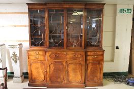 A Georgian style mahogany breakfront four door bookcase, width 197cm.