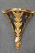 A gilt wooden wall bracket, width 43 cm. CONDITION REPORT: Twentieth century reproduction but a nice