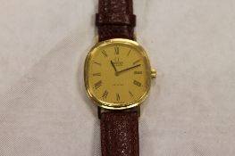 An 18ct gold Omega De Ville Gentleman's wrist watch, on leather strap. CONDITION REPORT: Good