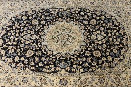 An Iranian wool carpet, on cream ground, 204 cm x 125 cm.
