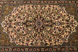 An Iranian wool rug, on cream ground, 127 cm x 82 cm.
