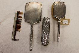 A silver backed four piece dressing table set, Walker & Hall, Sheffield 1928. (4) CONDITION