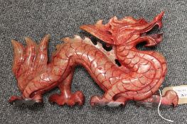 A Chinese stone carving, depicting a dragon, length 31.5 cm. CONDITION REPORT: Thought to be
