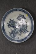 A late nineteenth century Chinese plaque - decorated with birds in foliage, diametre 46.5 cm.