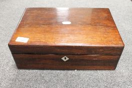 A Victorian rosewood writing box, inlaid with mother of pearl, width 35 cm. CONDITION REPORT: Good