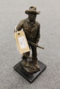 A bronze study depicting a cowboy on black marble plinth, height 30 cm.  CONDITION REPORT: Good