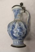 A nineteenth century tin-glazed blue and white ewer, with pewter mounts, height 29 cm. CONDITION