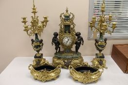 A nineteenth century style Italian five piece clock garniture, in gilt brass and green marble. (