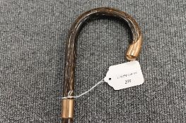 An early twentieth century bamboo walking stick mounted in 9ct gold. CONDITION REPORT: Good