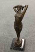 After Phillips - Art Deco style Lady leaning backwards on black marble plinth, height 41 cm.