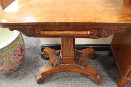 A Regency mahogany card table on carved pedestal base, width 92cm.