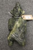A Chinese carved green stone figure depicting a mythical warrior, height 24 cm.  CONDITION REPORT: