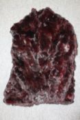 A vintage ruby rabbit fur jacket.