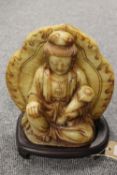 A Chinese stone carving depicting a seated female figure  CONDITION REPORT: good condition,