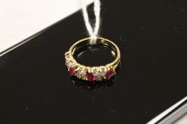An 18ct gold diamond and ruby ring. CONDITION REPORT: Good condition