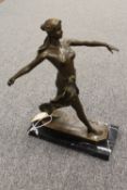 A bronze figure depicting a Lady walking, indistinctly signed, on black marble plinth height 31 cm.