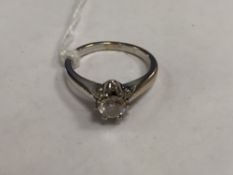 An 18ct white gold diamond cluster ring.