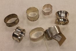 A pair of silver napkin rings, George Unite, Birmingham 1924, together with five other silver napkin