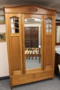 A late Victorian five piece walnut bedroom suite, comprising of mirror door wardrobe,