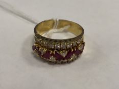 An 18ct gold diamond and ruby ring.