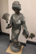 A bronze study of a Geisha, height 123cm.