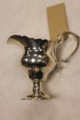 A silver cream jug, London 1896, 3 oz. CONDITION REPORT: Good condition, with a lightly engraved 'H'
