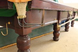 A full size snooker table, slate bed, length 384cm, together with overhead table light,