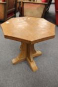 A Robert Thompson of Kilburn (Mouseman) carved oak octagonal occasional table, width 50cm.