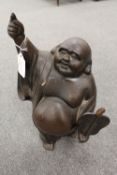 An early twentieth century bronze figure depicting an Oriental Gentleman in robes, 36.5 cm.
