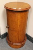 A late Victorian pitch pine cylindrical pot cupboard, height 72cm.