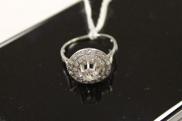 A diamond cluster ring, the central stone approximately 0.5ct. CONDITION REPORT: Tested as white