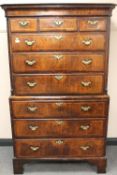 An eighteenth century inlaid walnut nine drawer double chest on bracket feet, width 106cm.