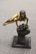 A contemporary bronze figure - Lady raised on her hands, on black marble plinth, height 33 cm.