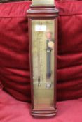 An Admiral Fitzroy barometer, in a mahogany case.