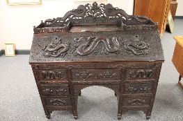 A late nineteenth century Chinese carved hardwood bureau, with 123cm.
