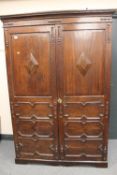 A nineteenth century oak Gentleman's wardrobe, fitted, width 132cm.