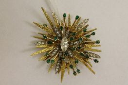 An 18ct gold and platinum 'Starburst' brooch, signed G.
