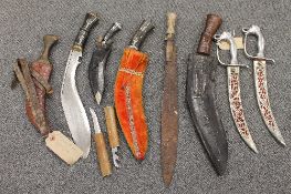 A collection of nine bladed weapons including jambiya, kukri etc. (9) CONDITION REPORT: Fair