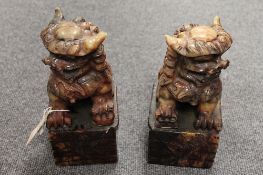 A pair of Chinese carved stone figures depicting Fu dogs, height 23 cm.  CONDITION REPORT: Thought